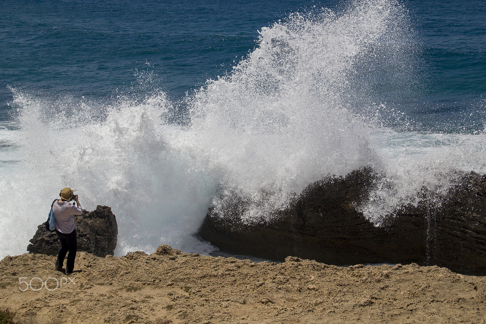 Canon EOS 550D (EOS Rebel T2i / EOS Kiss X4) + Canon EF-S 18-200mm F3.5-5.6 IS sample photo. Photographer catches the big waves crashing down . photography