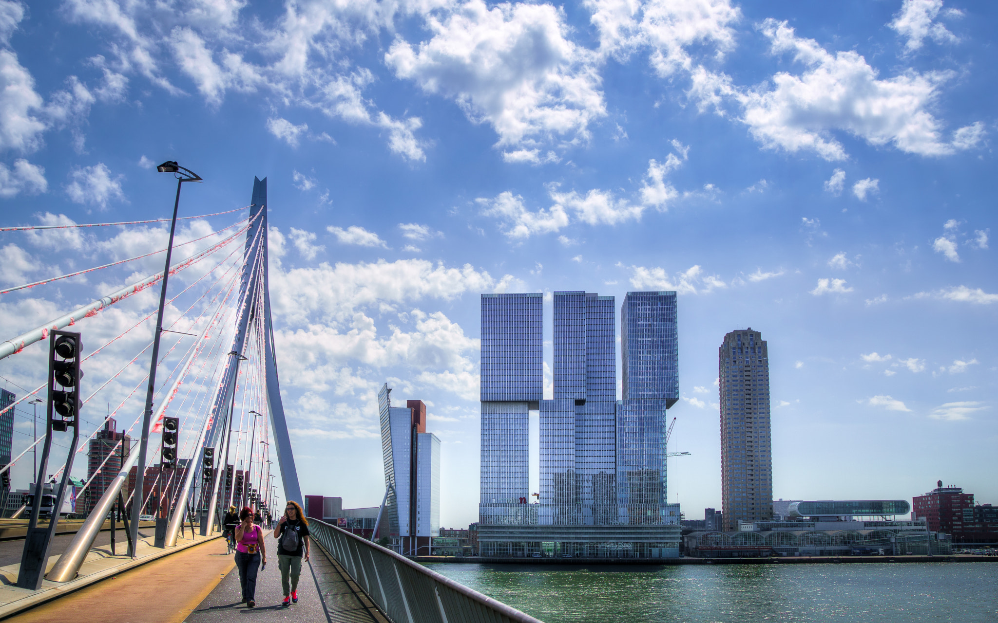 Sony ILCA-77M2 + Tamron SP 24-70mm F2.8 Di VC USD sample photo. Walking over the erasmus bridge photography