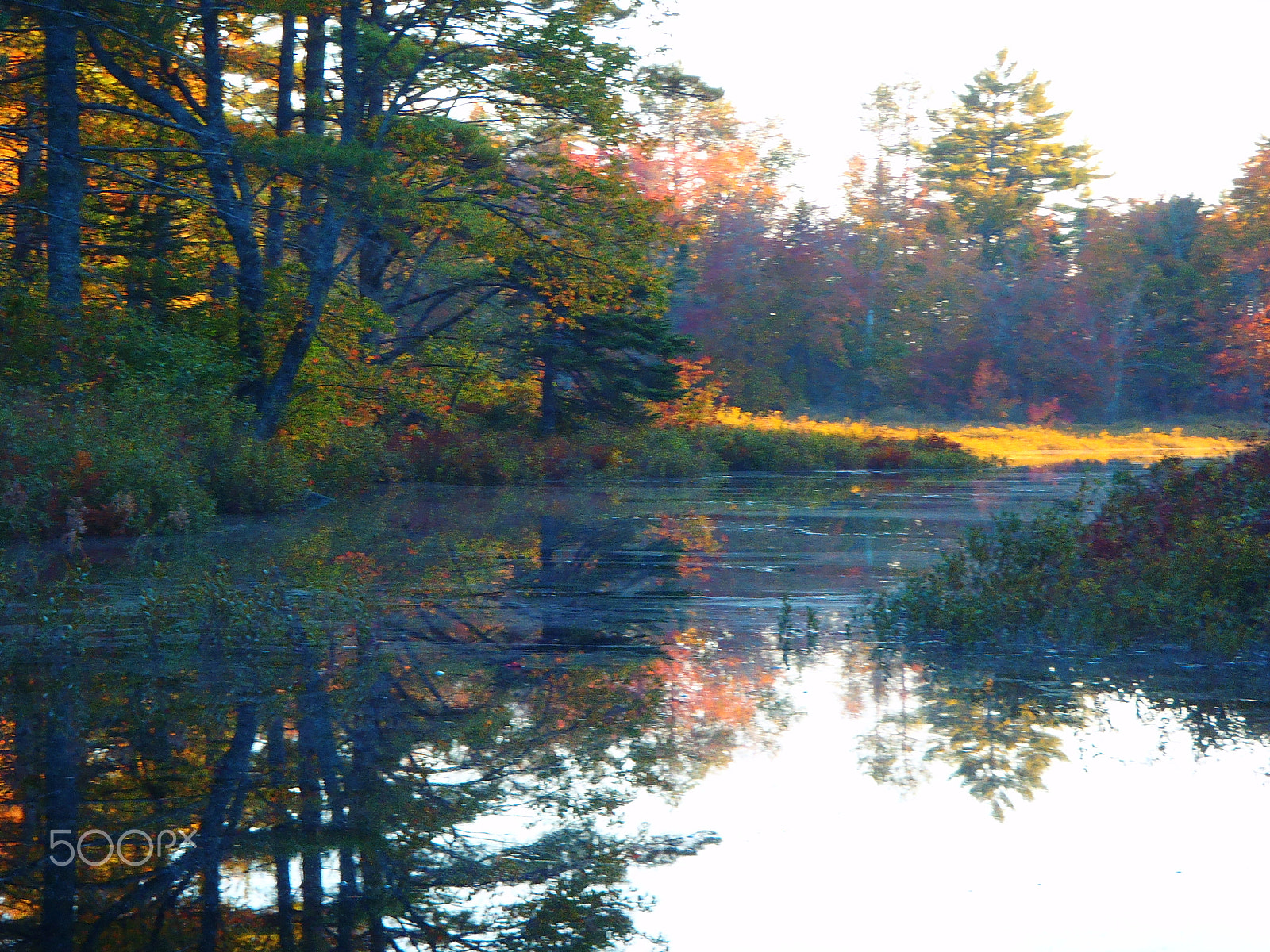 Olympus TG-610 sample photo. Canoeing in a stillwater at sunset photography