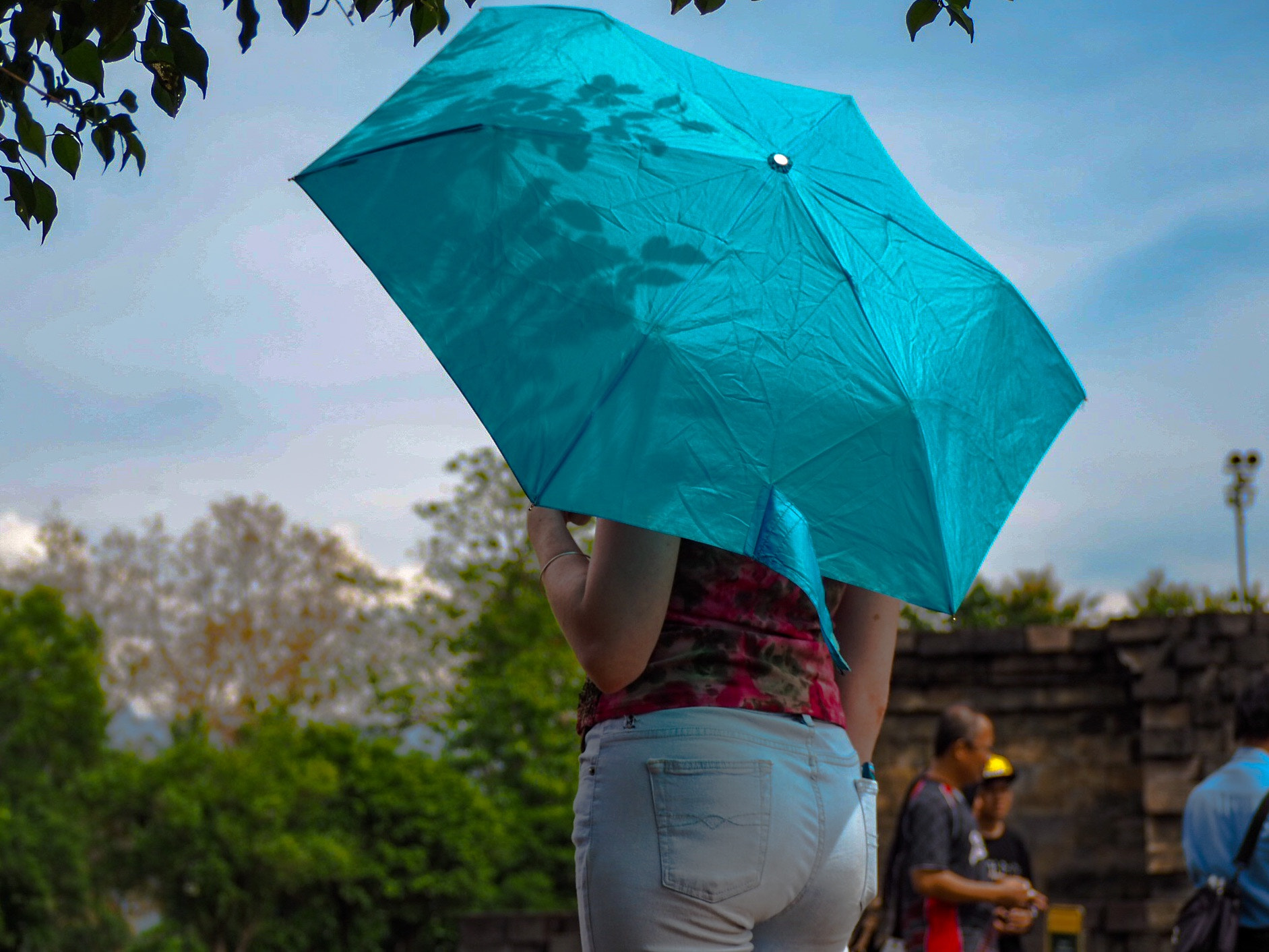 Olympus PEN-F sample photo. Who's behind an umbrella? photography