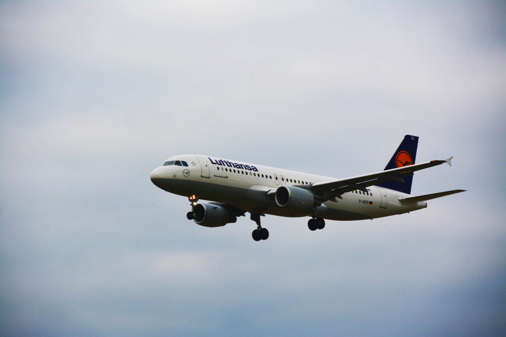 Nikon D7100 + Nikon AF Nikkor 14mm F2.8D ED sample photo. Landing airplane photography