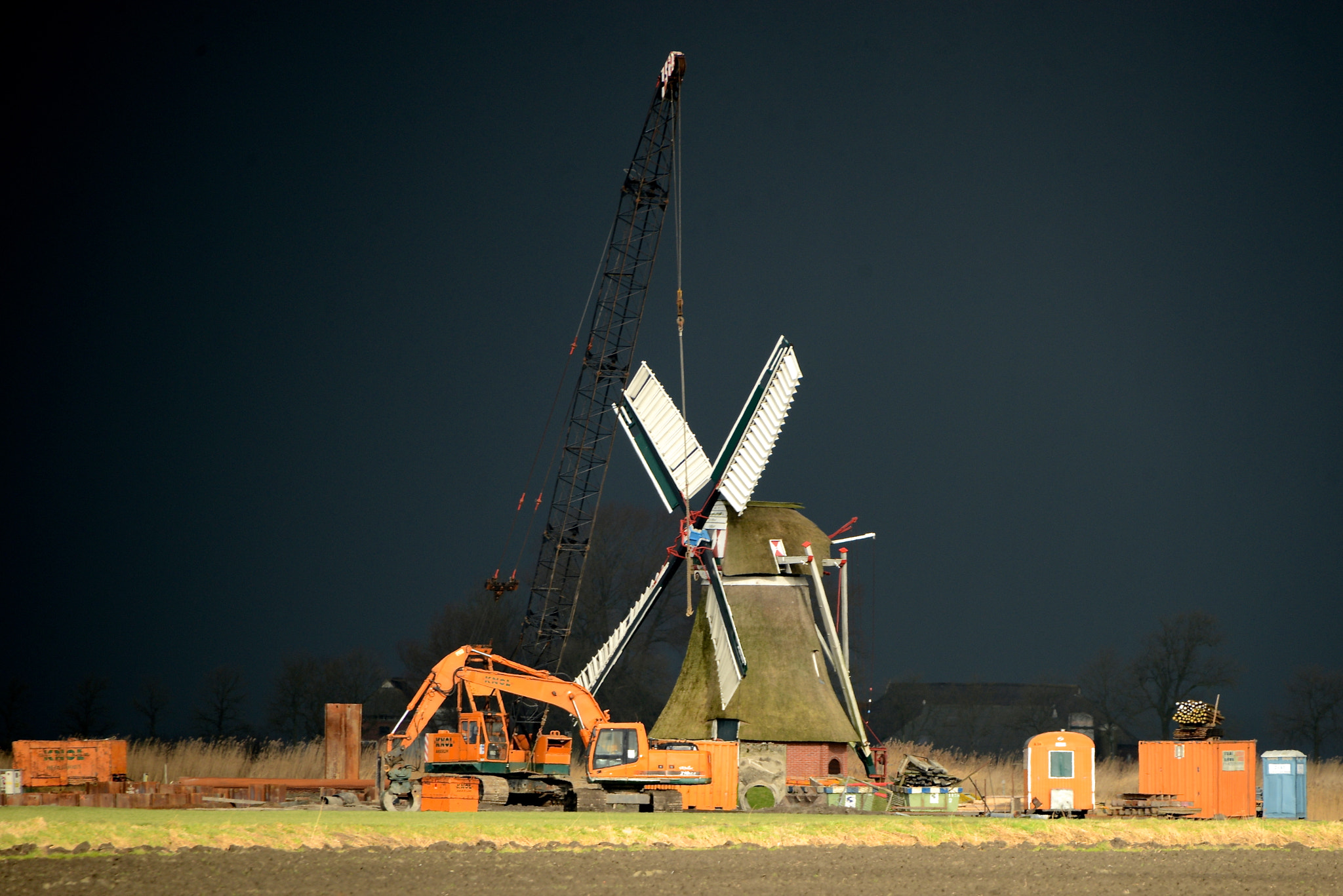 Sigma 50-500mm F4.5-6.3 DG OS HSM sample photo. Dark sky behind the windmill photography