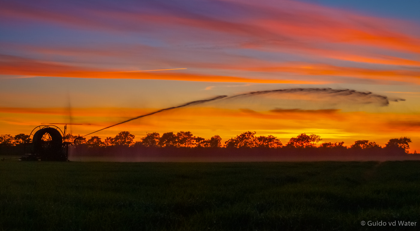 Olympus E-520 (EVOLT E-520) + OLYMPUS 18mm-180mm Lens sample photo. Sunset over farming land photography