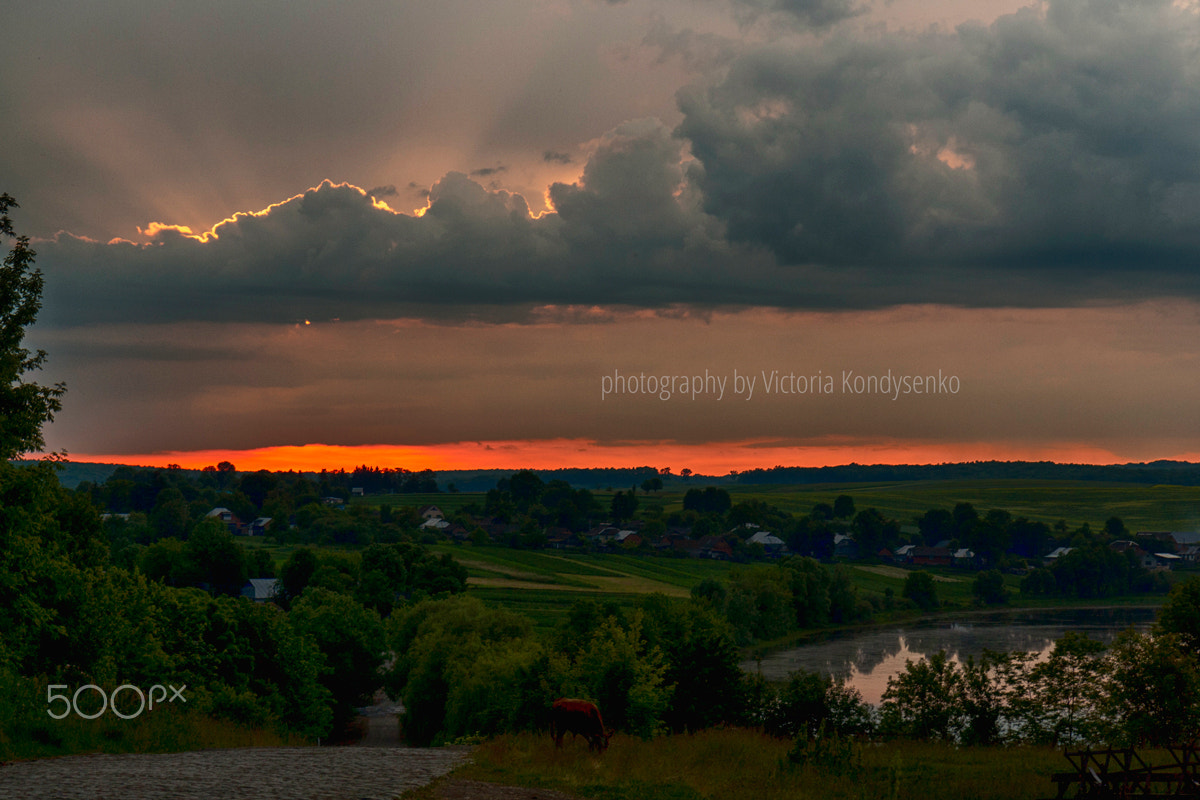 Canon EOS 1000D (EOS Digital Rebel XS / EOS Kiss F) sample photo. Fiery sunset  and dramatic clouds photography