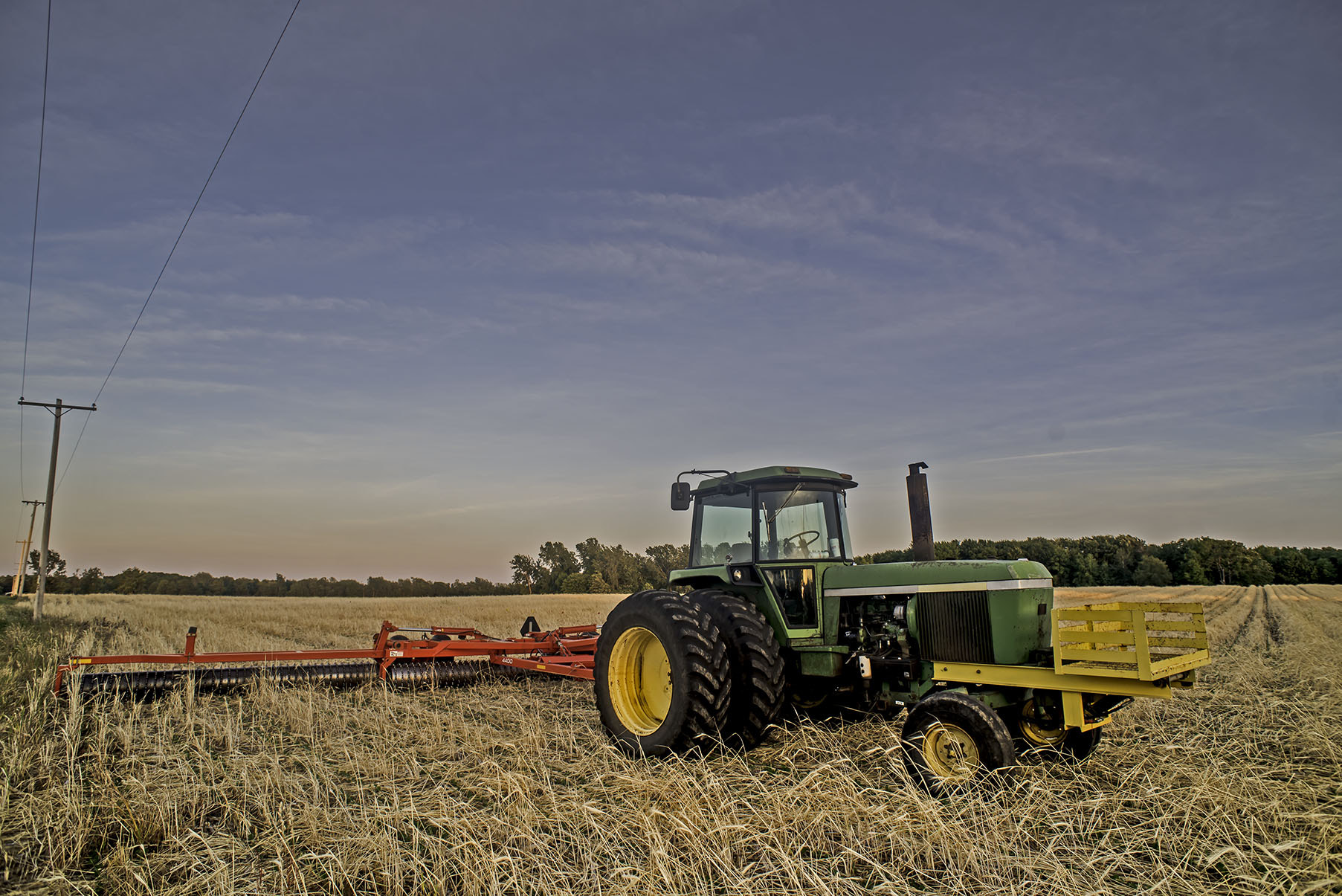 Nikon D750 + Nikon AF Nikkor 20mm F2.8D sample photo. Tractor in filed on randall road, stafford, ny photography