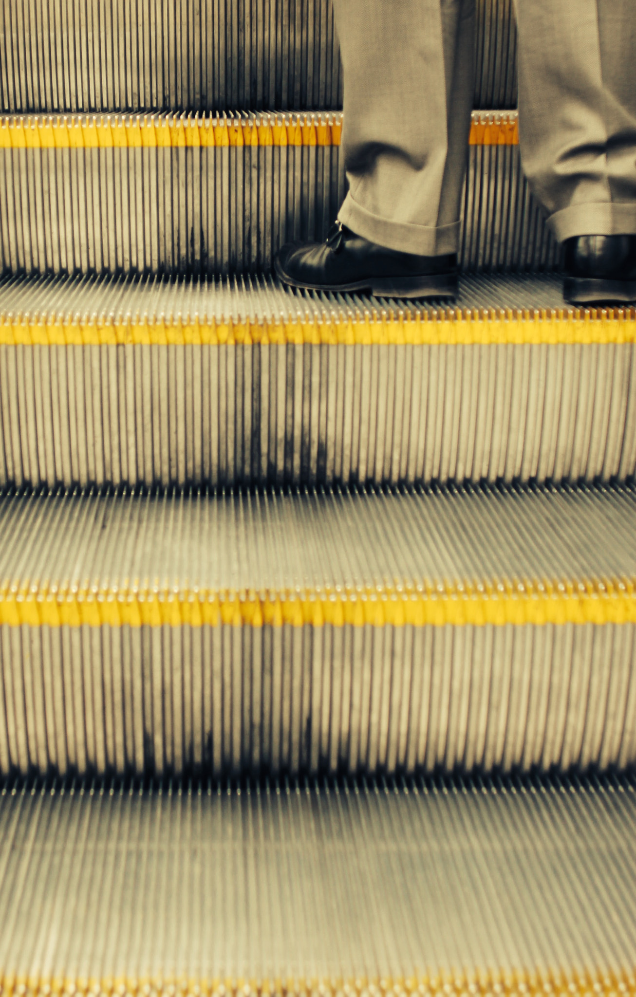 Canon EF 28mm F2.8 sample photo. Man ascending escalator photography