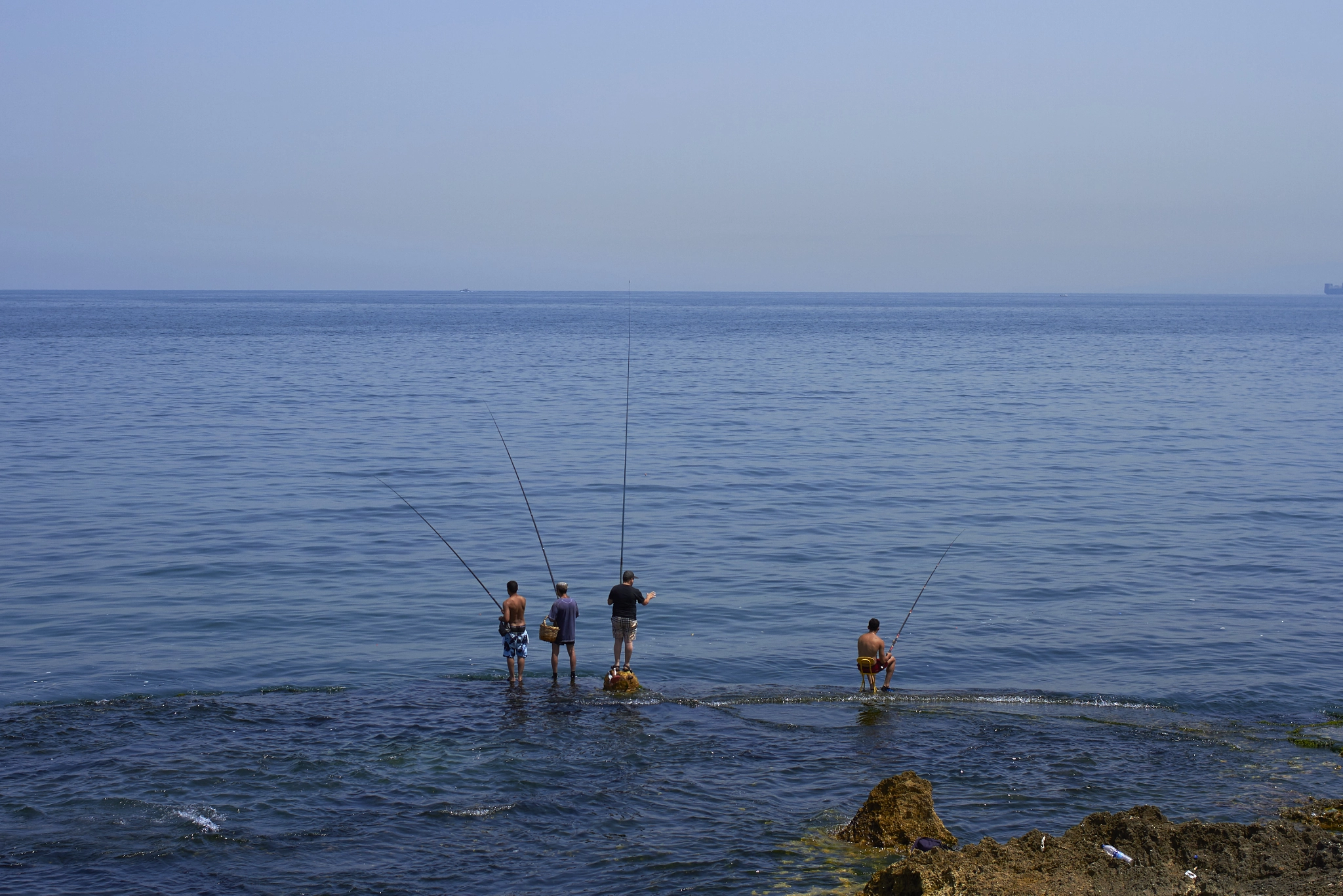 Canon EOS 7D + Canon EF 35mm F2 sample photo. Four fishermen in beirut photography
