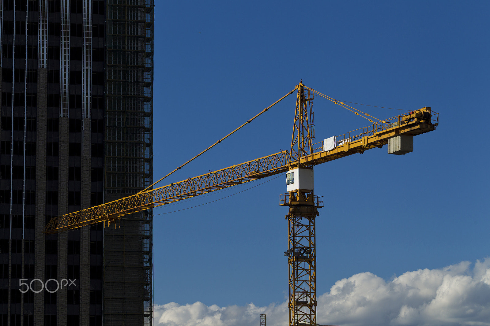 Canon EOS-1D Mark IV sample photo. Tower crane on the background of the building is building photography
