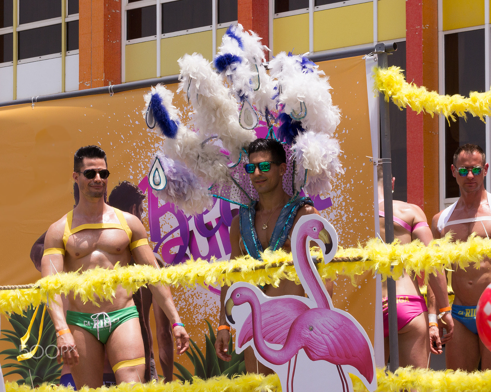 Canon EF 75-300mm F4.0-5.6 IS USM sample photo. Members of pride parade poses for the photographer photography