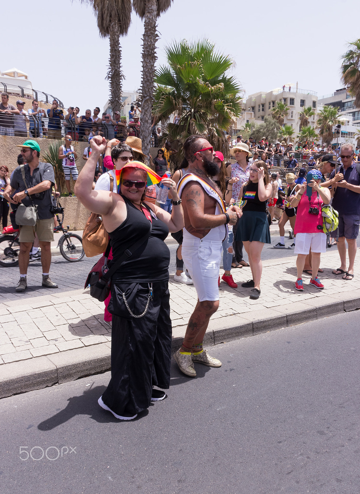 Canon EF 75-300mm F4.0-5.6 IS USM sample photo. Members of pride parade poses for the photographer photography