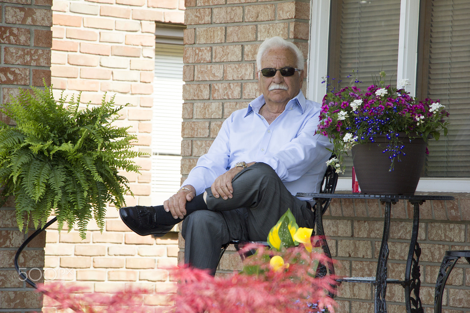 Canon EOS 550D (EOS Rebel T2i / EOS Kiss X4) + Canon EF-S 18-135mm F3.5-5.6 IS STM sample photo. Grandpa on porch photography