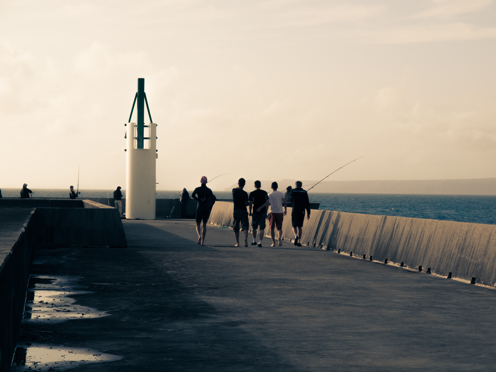 Olympus Zuiko Digital 14-54mm F2.8-3.5 II sample photo. Youngsters walking on the pier photography