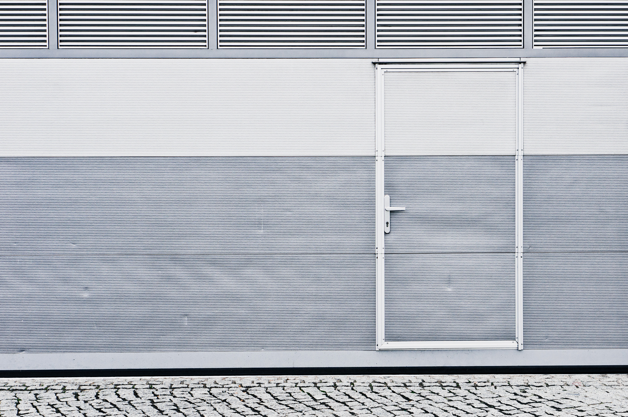 Sony Alpha NEX-5 + E 50mm F1.8 OSS sample photo. Metal door photography