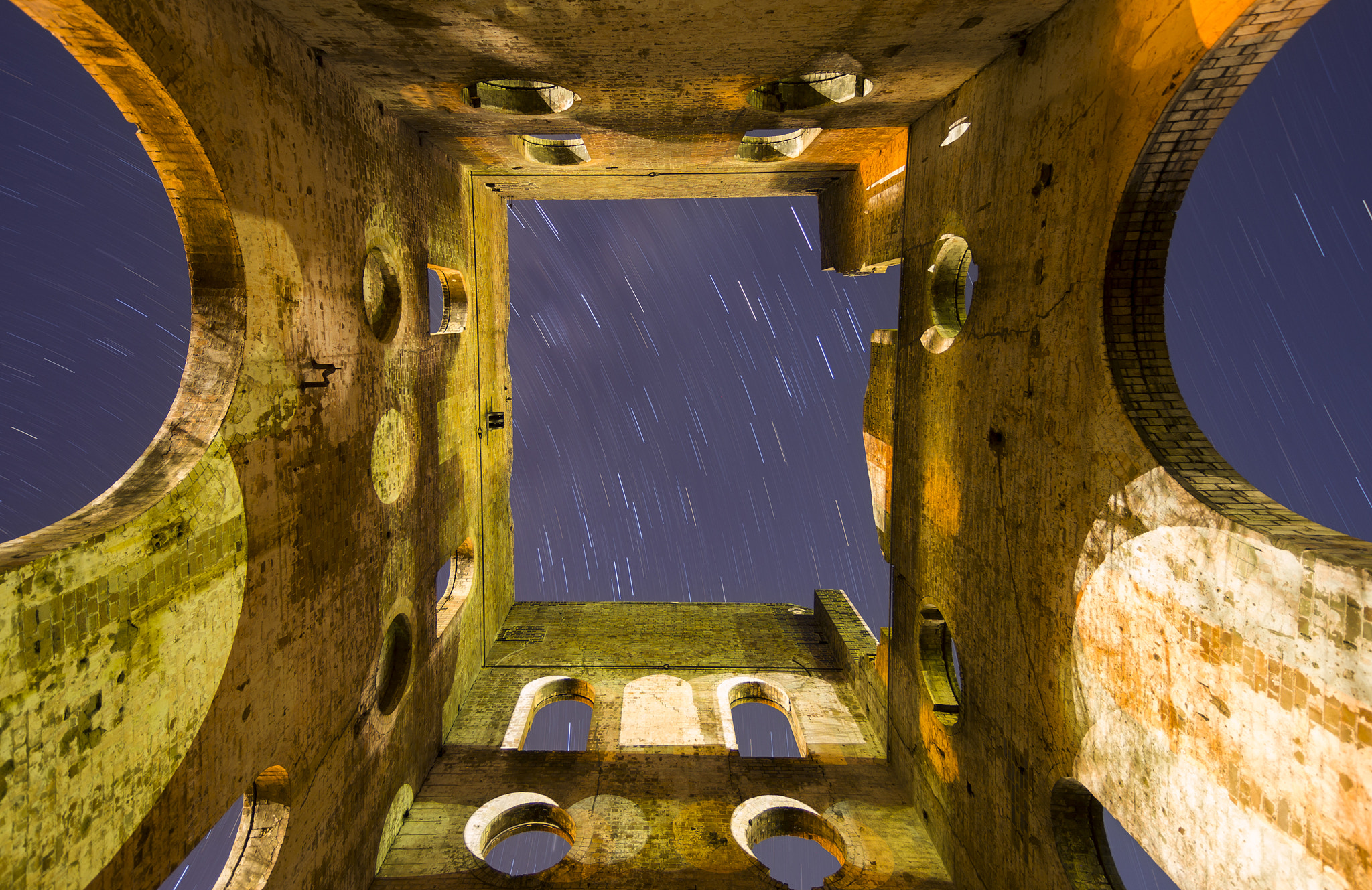 Tokina AT-X Pro 12-24mm F4 (IF) DX sample photo. Star trails over ruins photography