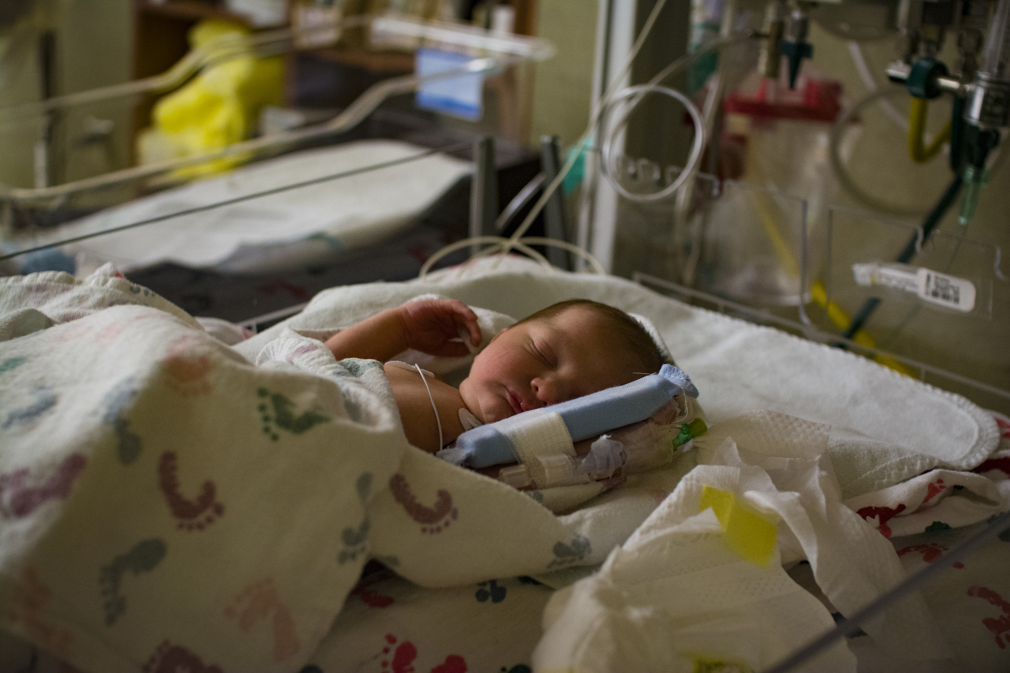 Nikon D5200 + Sigma 30mm F1.4 EX DC HSM sample photo. Newborn infant baby in incubator at hospital photography