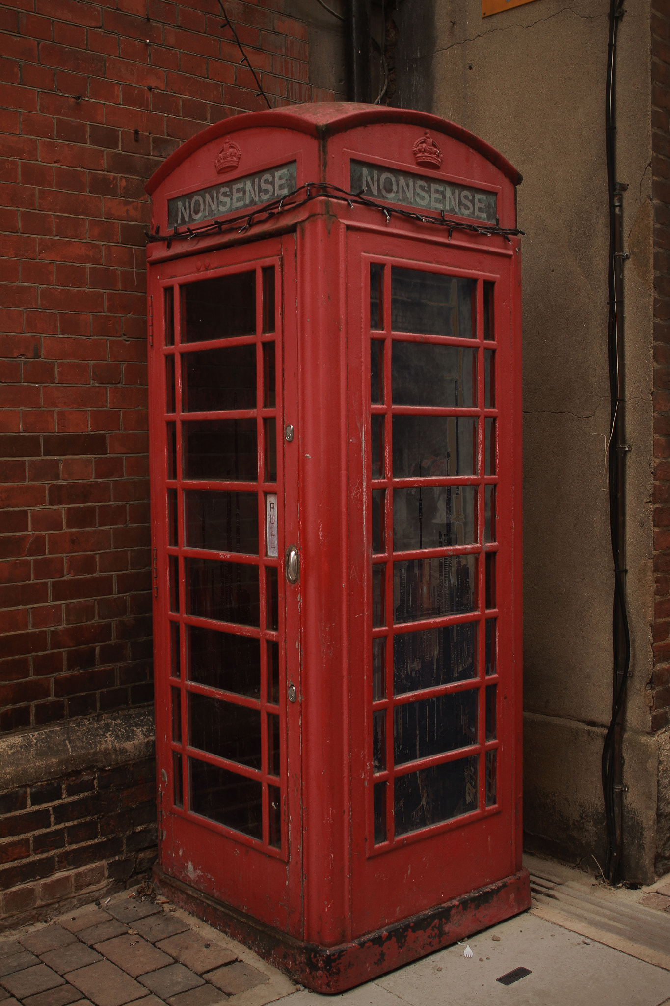 Canon EF 24mm F2.8 IS USM sample photo. Nonsense phonebooth photography