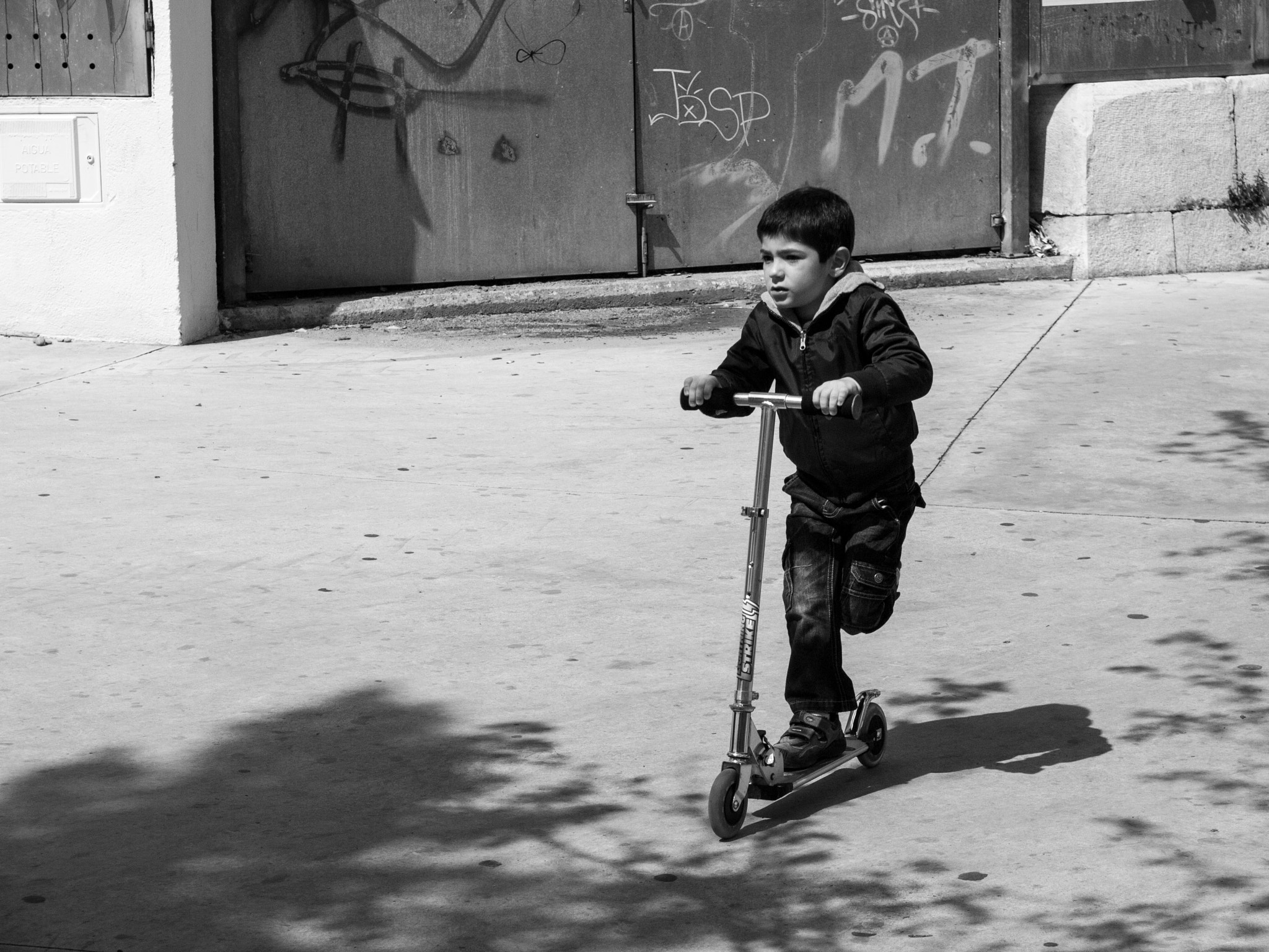 Olympus E-30 + Olympus Zuiko Digital 14-54mm F2.8-3.5 II sample photo. Boy on his scooter photography