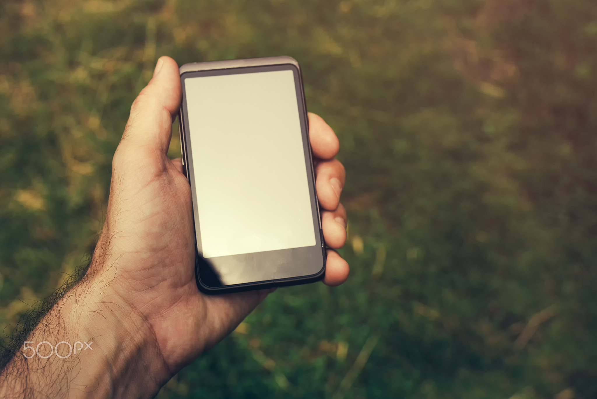 Smartphone in male hand, selective focus