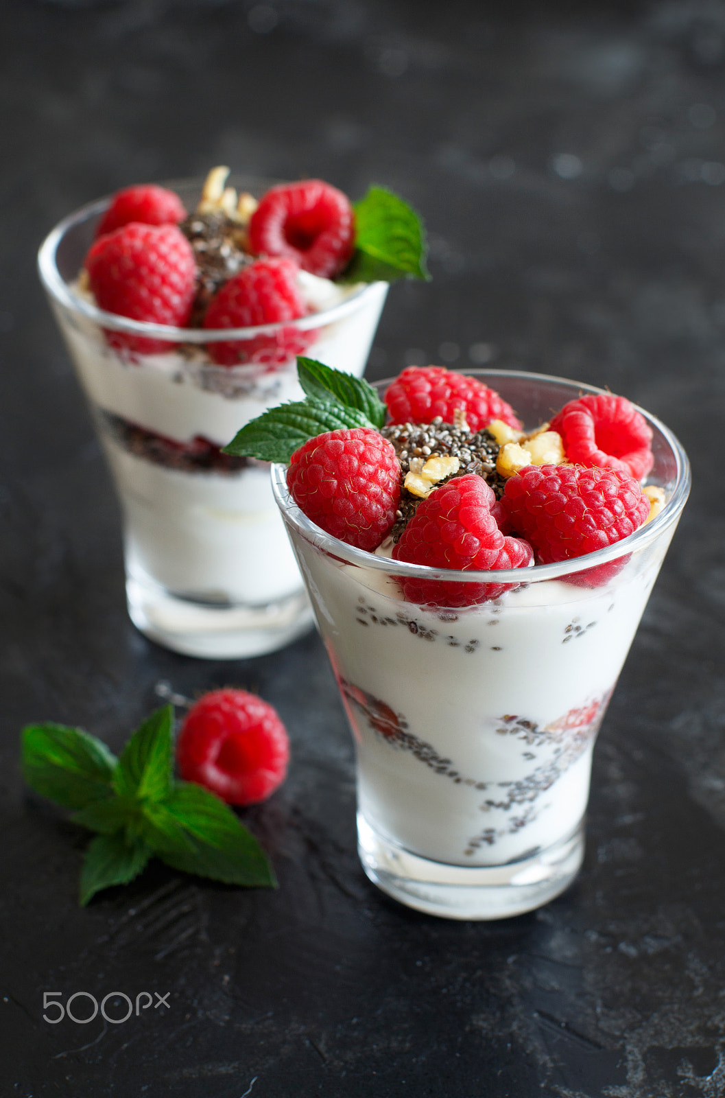 Canon EOS 650D (EOS Rebel T4i / EOS Kiss X6i) + Canon EF 50mm F1.2L USM sample photo. Yogurt with chia seeds, walnuts and raspberries photography
