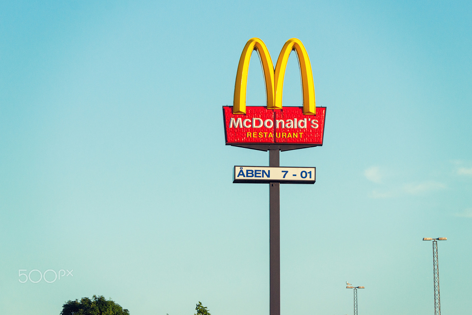 Sony 70-400mm F4-5.6 G SSM II sample photo. Mcdonalds billboard sign showing the opening hours photography