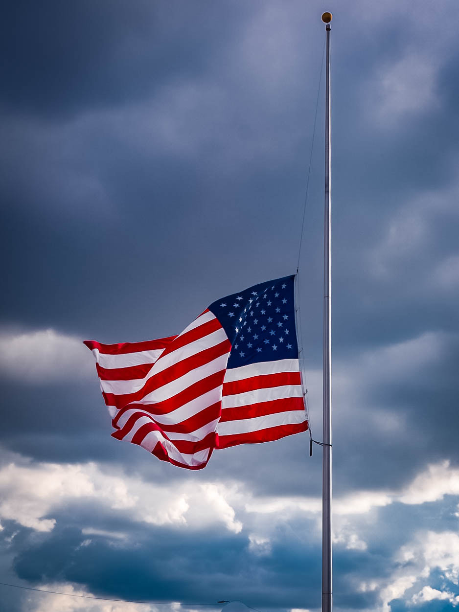 Olympus OM-D E-M5 II sample photo. Flying half mast in honor of muhammad ali  louisville, ky. photography