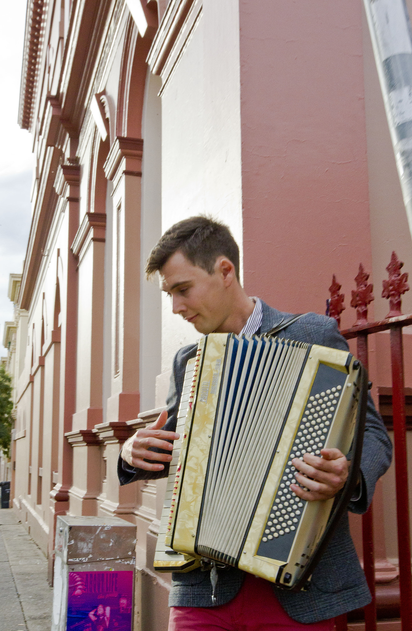 Canon EOS-1D Mark IV sample photo. Busker making the accordian sing in newtown photography