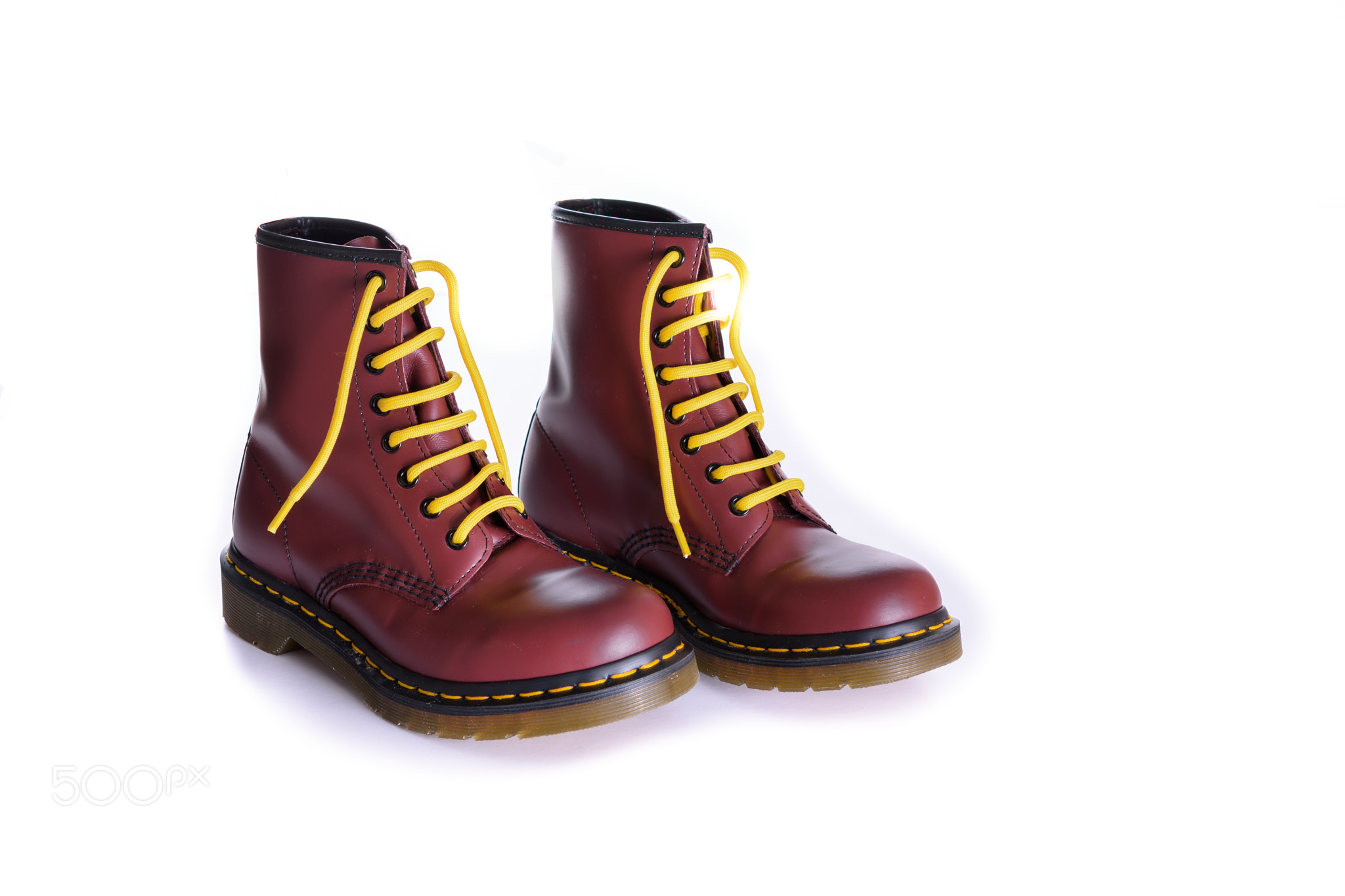 Classic cherry red oxblood lace-up boots with yellow laces