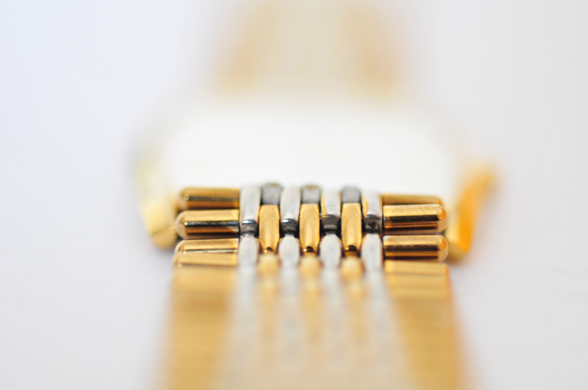 Nikon D300 + Nikon AF Micro-Nikkor 60mm F2.8D sample photo. Gold strap macro photography