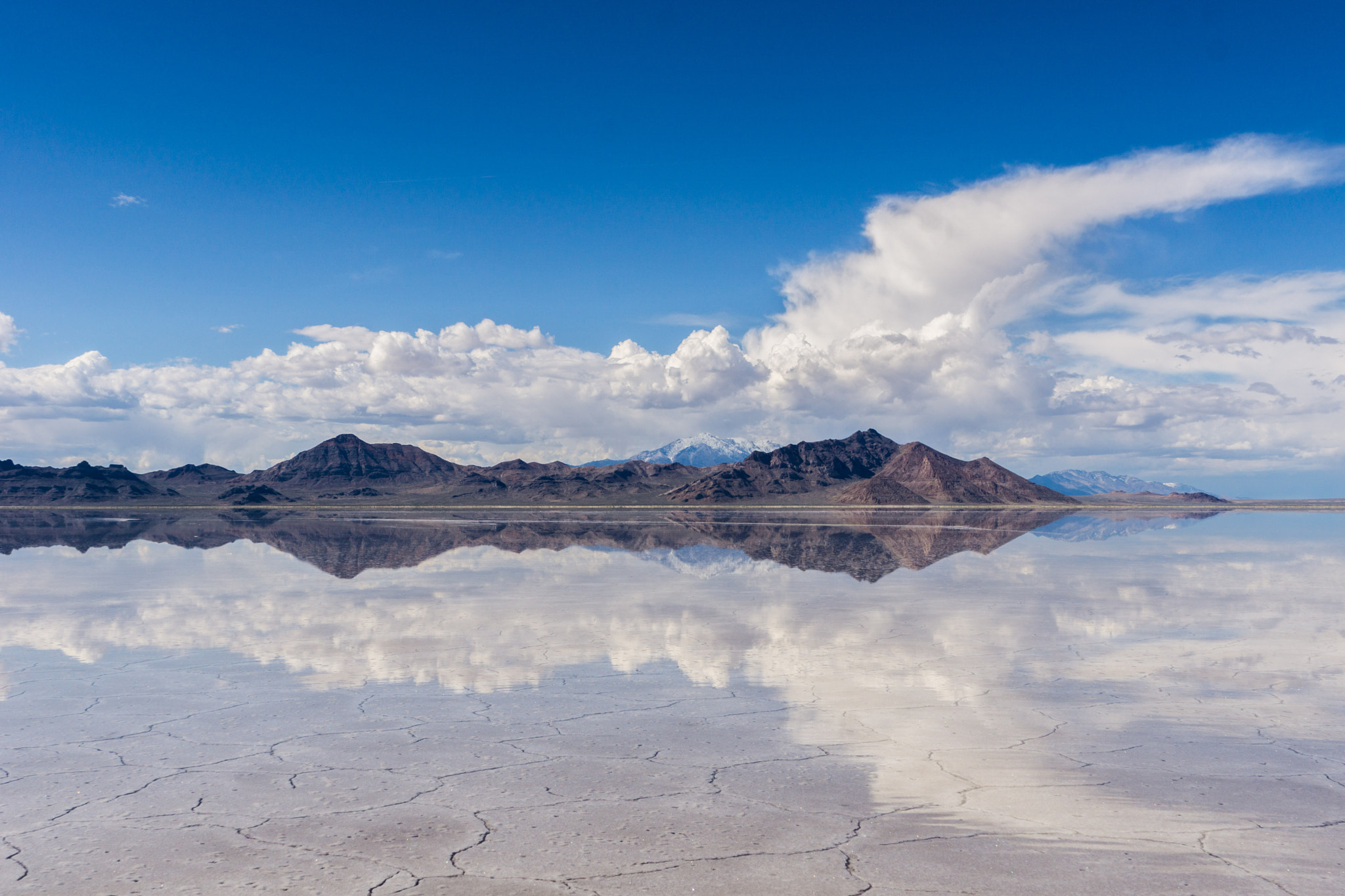 Sony a6000 + Sony FE 24-240mm F3.5-6.3 OSS sample photo. Clouds forming a rocket in a reflection photography