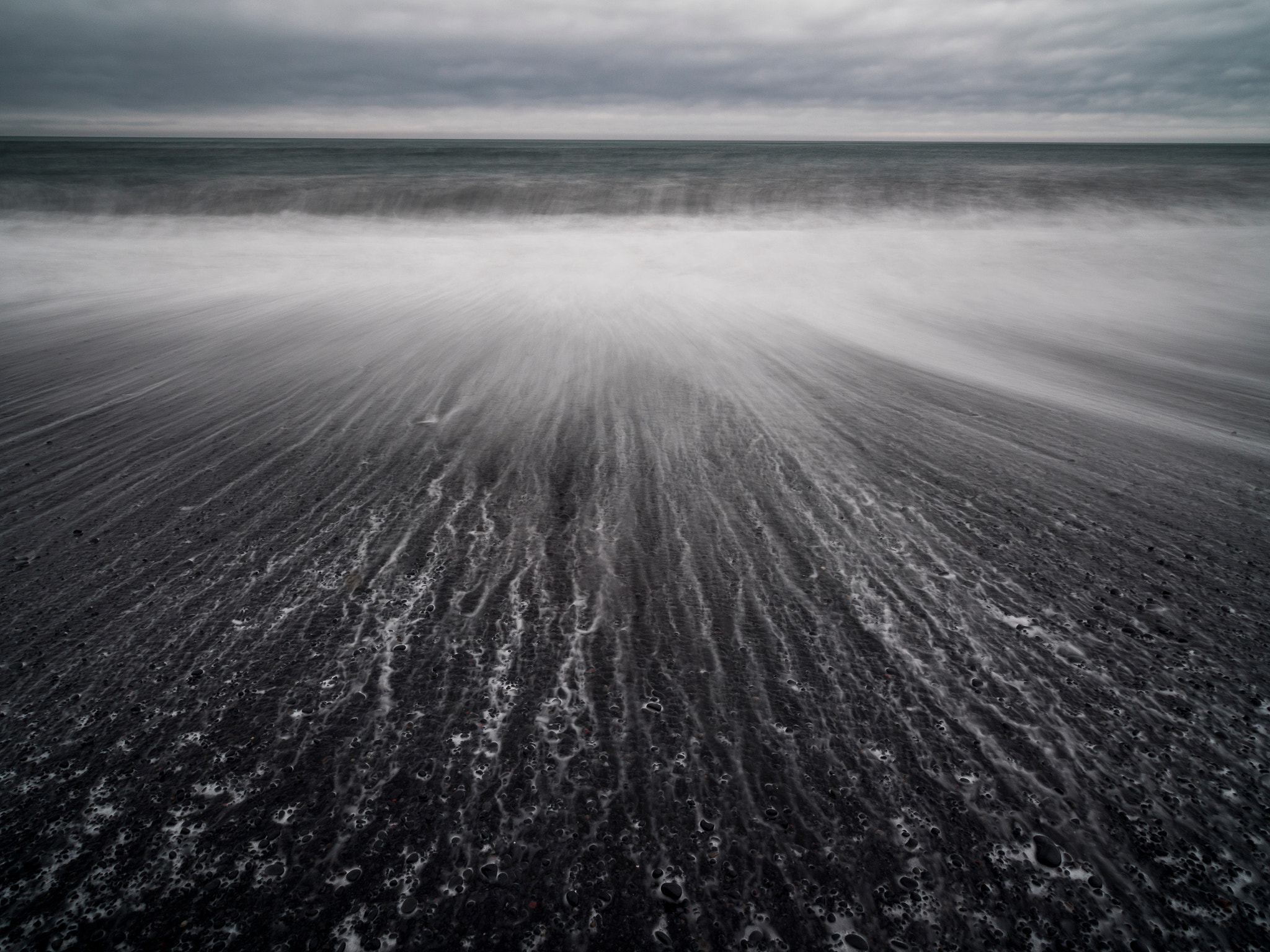 Olympus OM-D E-M5 + Olympus M.Zuiko Digital ED 7-14mm F2.8 PRO sample photo. Black sand beach in iceland. photography