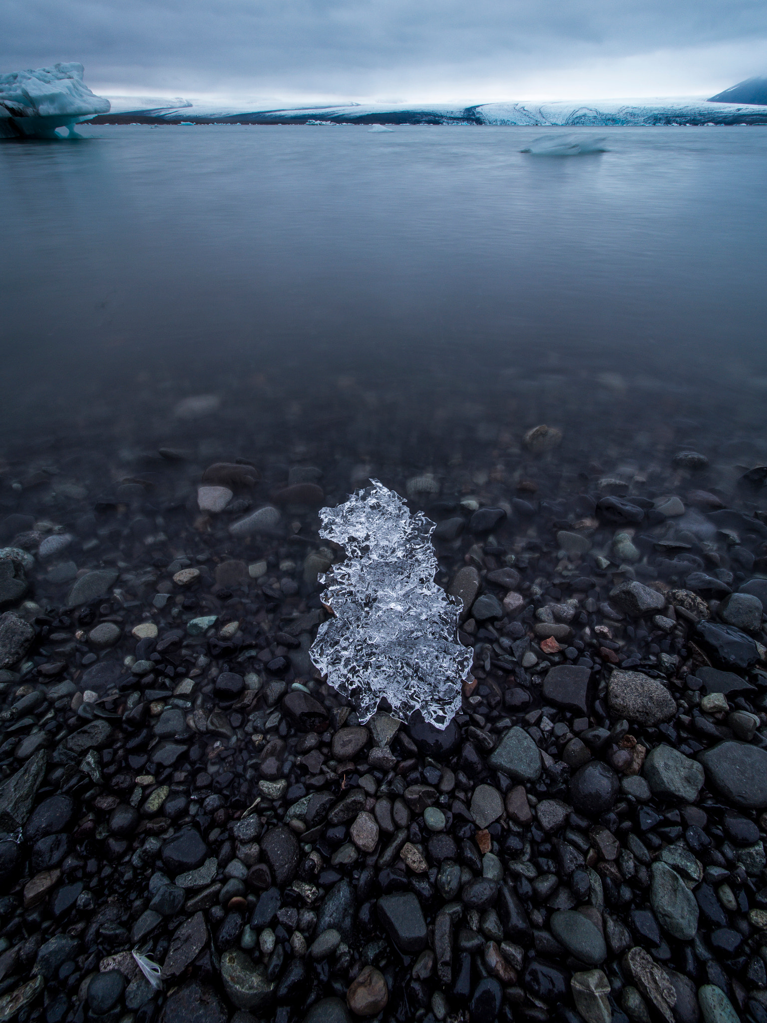 Olympus OM-D E-M5 + Olympus M.Zuiko Digital ED 7-14mm F2.8 PRO sample photo. Piece of ice stranded on a beach in glacier lagoon, iceland. photography