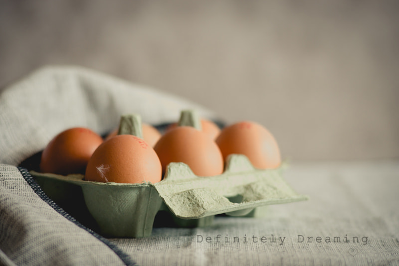 Sony a99 II sample photo. Just eggs, and a feather photography