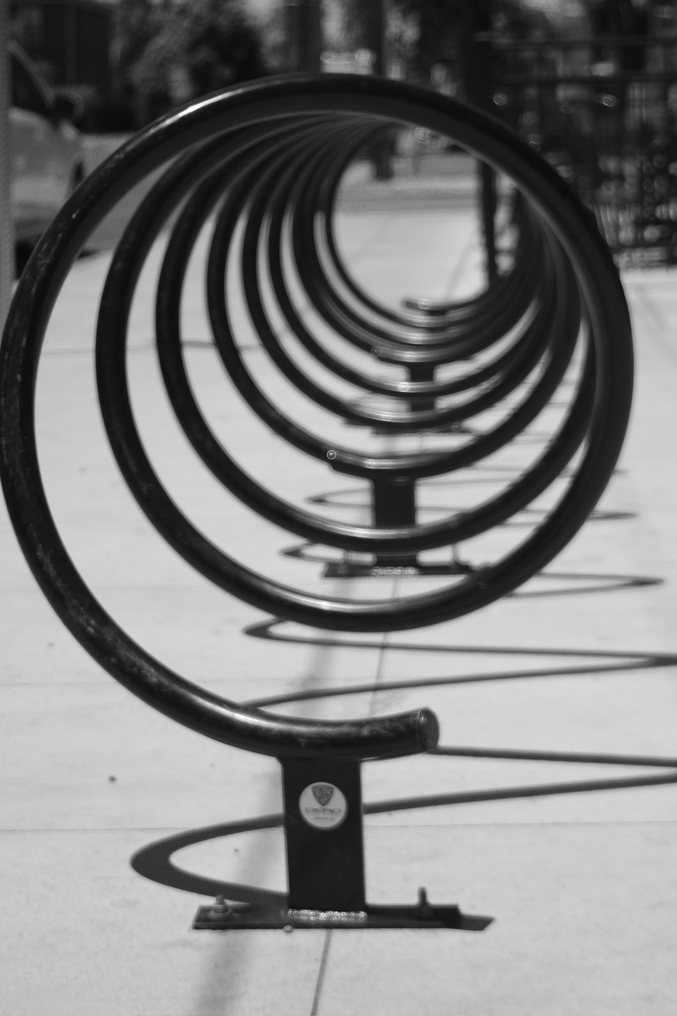 Sigma 18-125mm f/3.5-5.6 DC IF ASP sample photo. Black and white bicycle rack photography