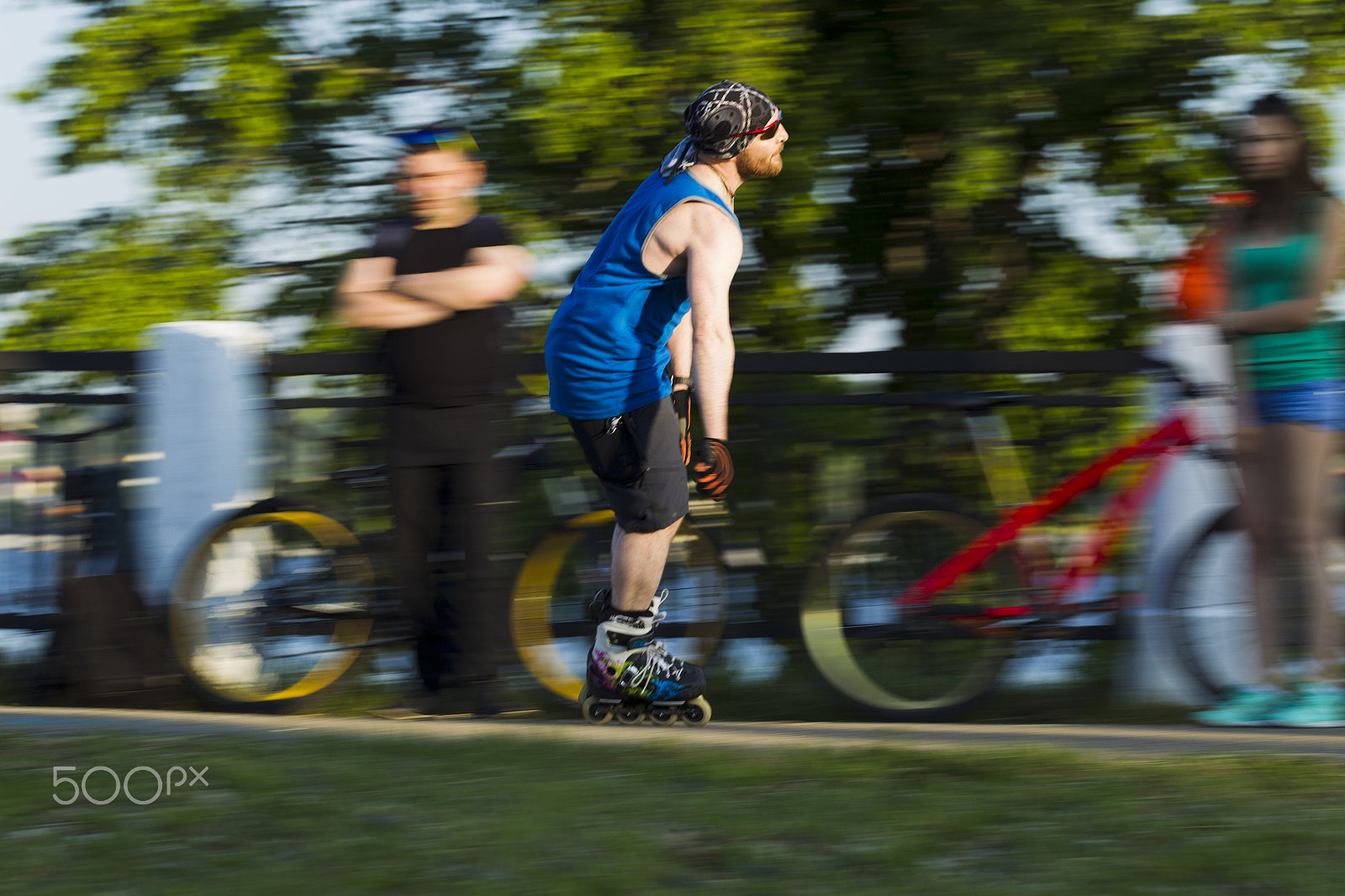 Canon EOS-1D Mark IV sample photo. A man riding on roller skates in the city photography