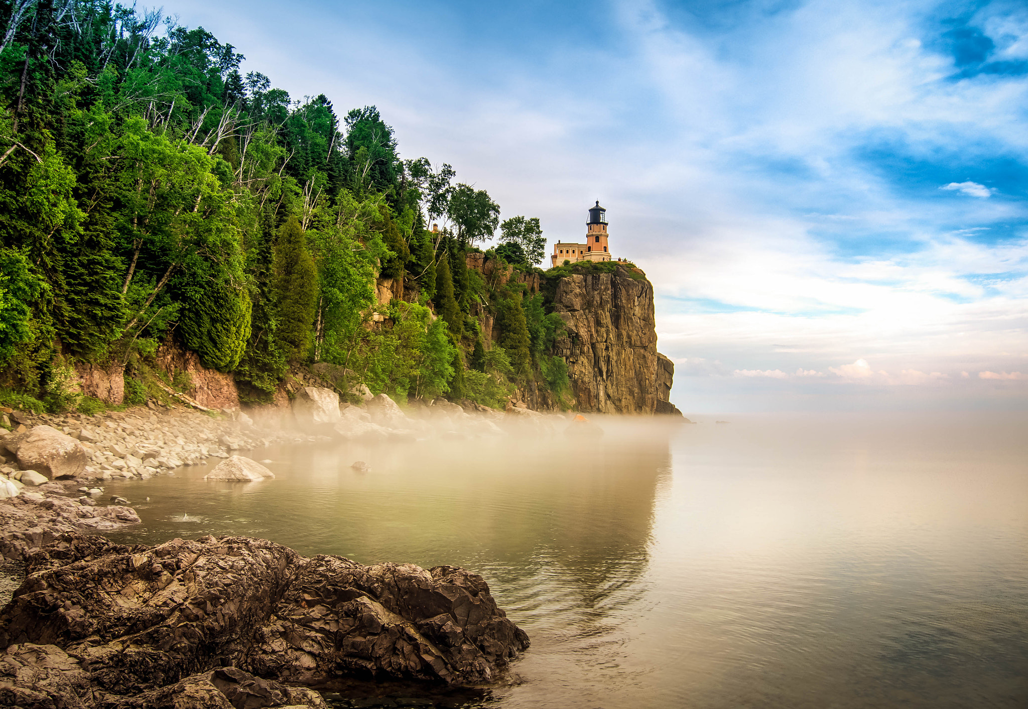 LUMIX G VARIO PZ 14-42/F3.5-5.6 sample photo. Lighthouse overlooking mist photography