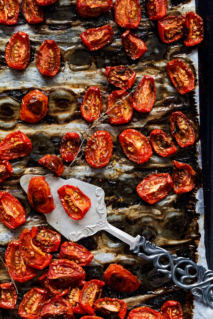Oven roasted tomatoes on a tray by Vladislav Nosick on 500px.com