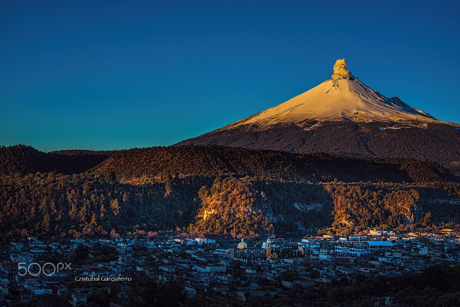 Sony a7R + Canon EF 50mm F1.4 USM sample photo. Smoking  volcano  with the first ray of sun photography