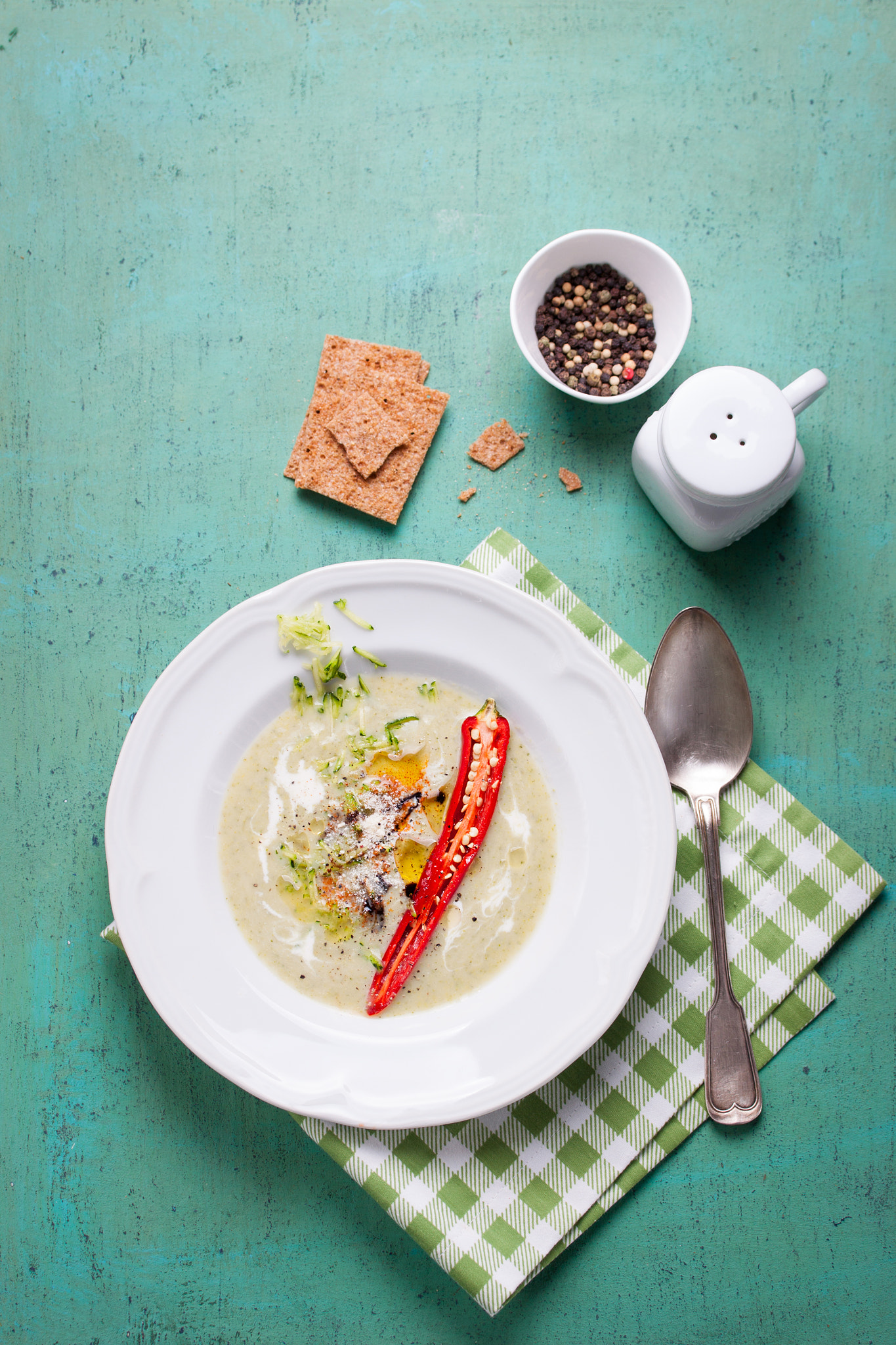 Canon EF-S 60mm F2.8 Macro USM sample photo. Zucchini cream soup with red pepper, cream, spices and balsamic cream on a wooden background, top... photography