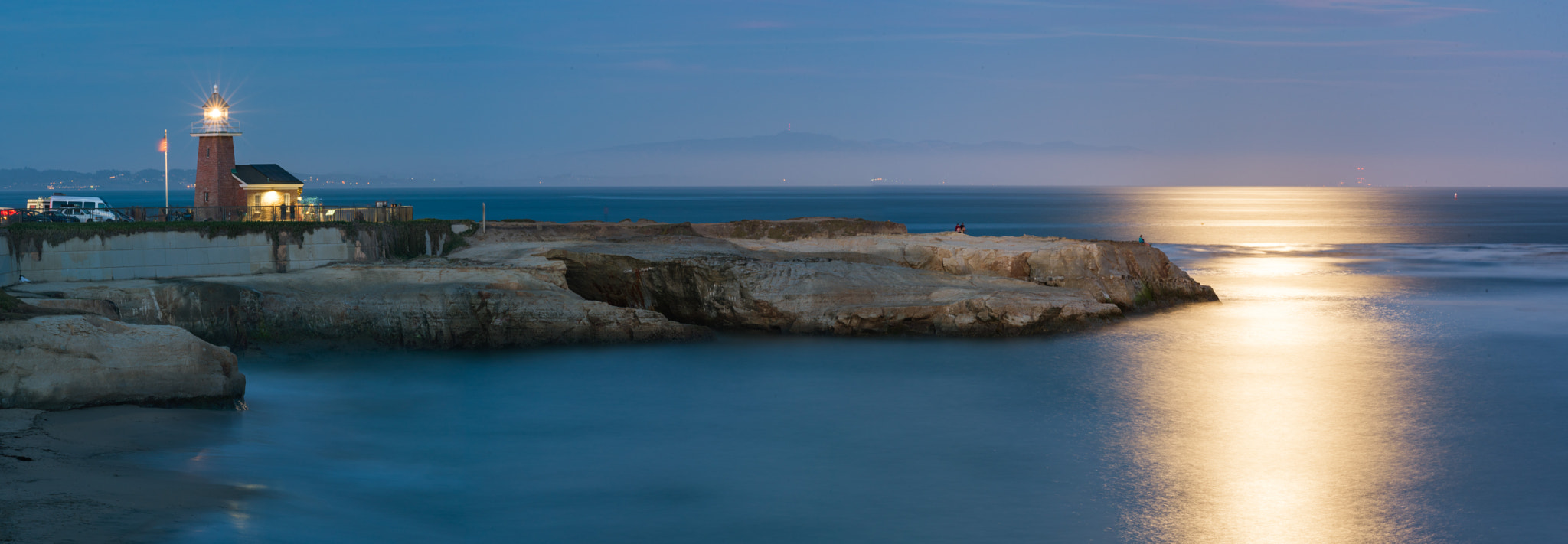 ZEISS Apo Sonnar T* 135mm F2 sample photo. Lighthouse with full moon reflection photography