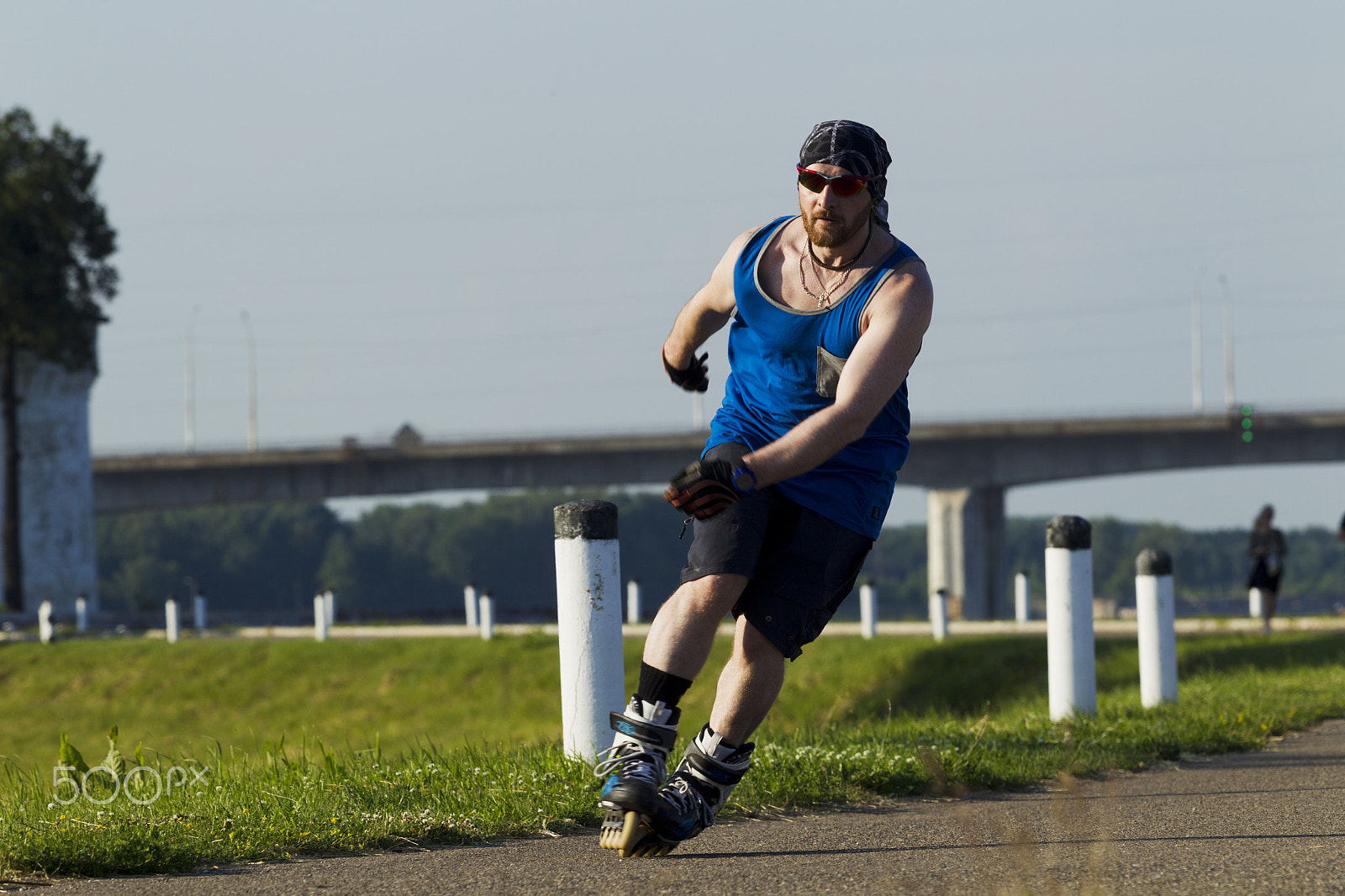 Canon EOS-1D Mark IV sample photo. A man riding on roller skates in the city photography