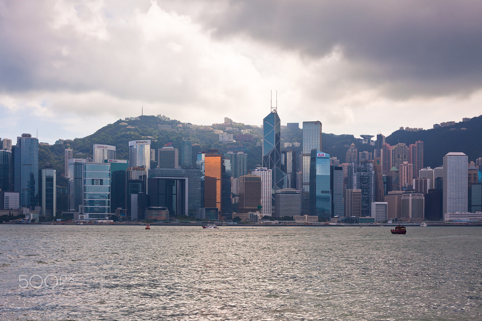 Canon EOS 5D Mark II + Canon EF 50mm F1.4 USM sample photo. Sea front view with luxurious buildings in hong kong photography