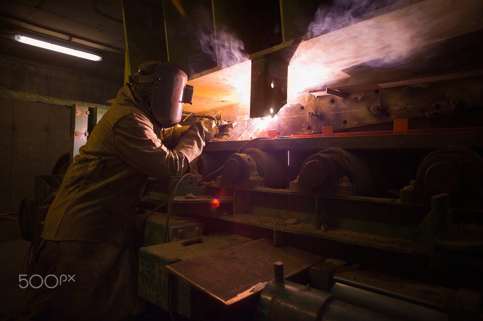 Kodak DCS Pro 14N sample photo. Welder repairing machinery at the plant of a copper mine in chile photography