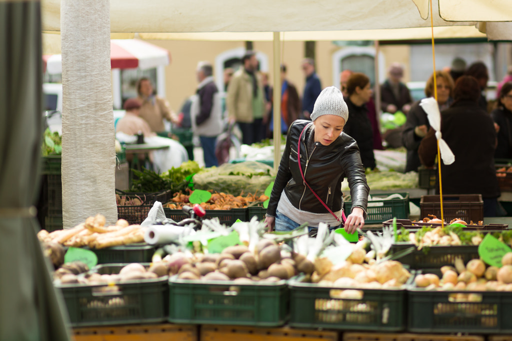 Woman buying vegetable at local food market. by Matej Kastelic on 500px.com