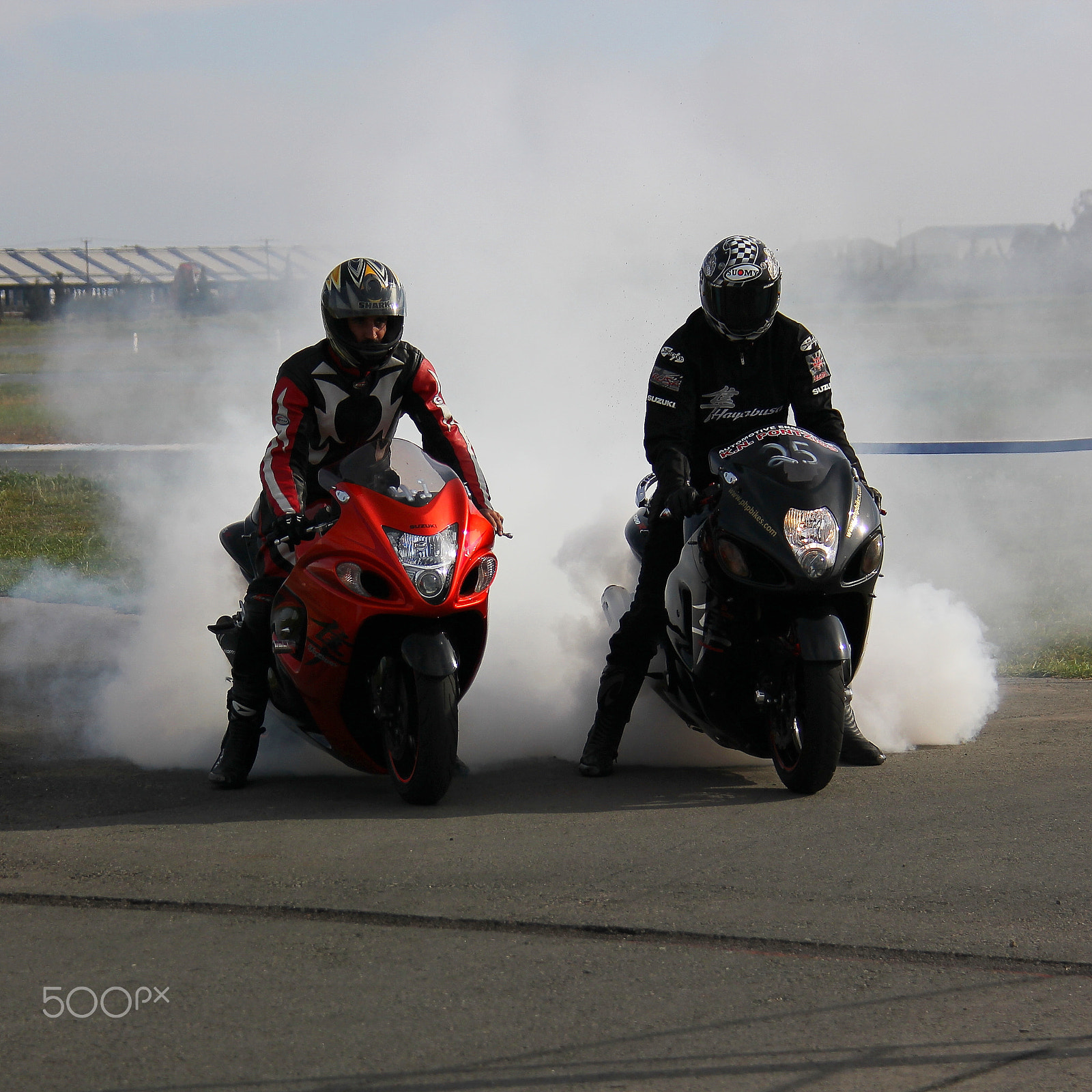 Canon EOS 550D (EOS Rebel T2i / EOS Kiss X4) + Canon EF-S 18-200mm F3.5-5.6 IS sample photo. Smoking bikes photography