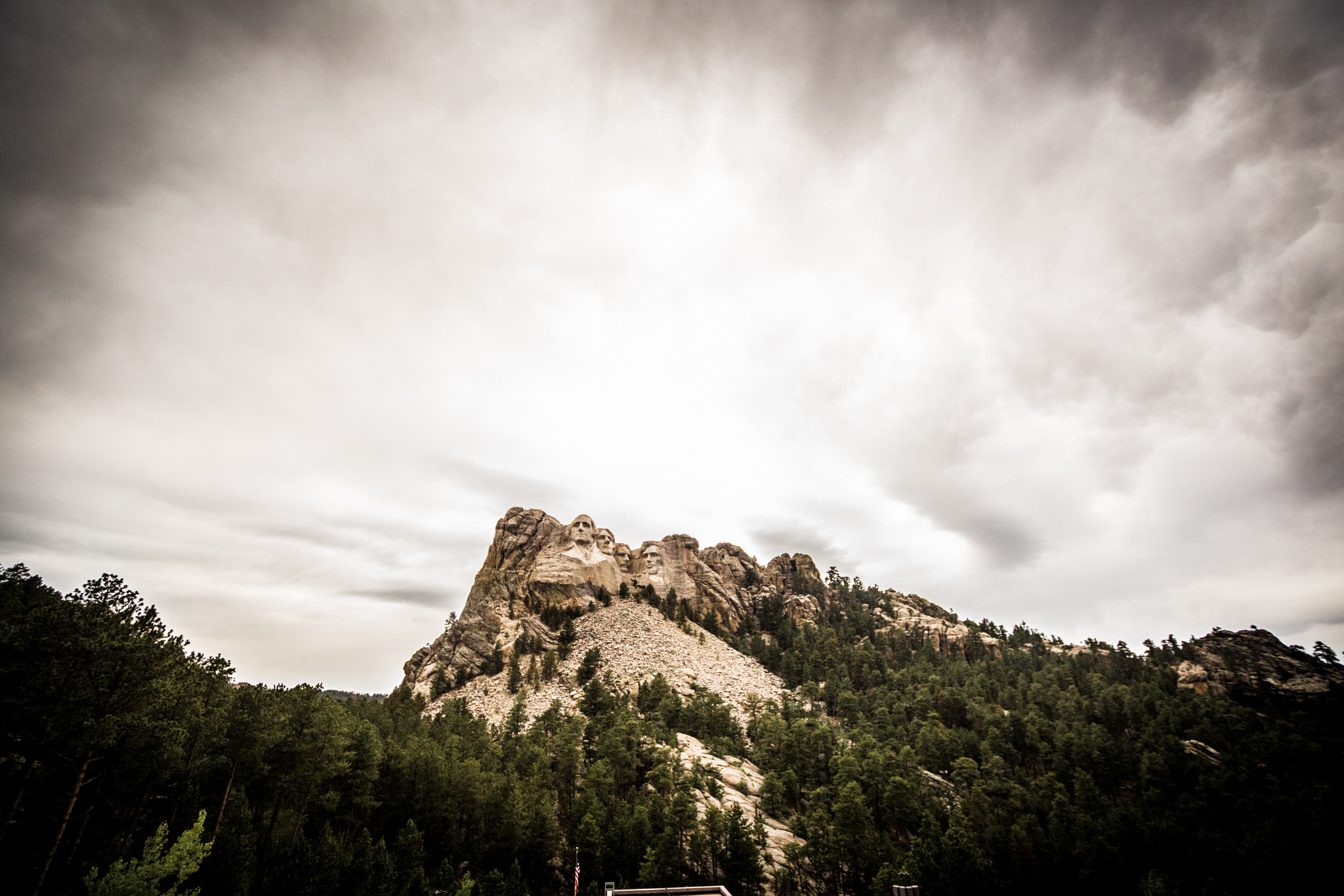 Sigma 15-30mm f/3.5-4.5 EX DG Aspherical sample photo. Mt. rushmore at sunset on a very cloudy day. great place to visit. photography
