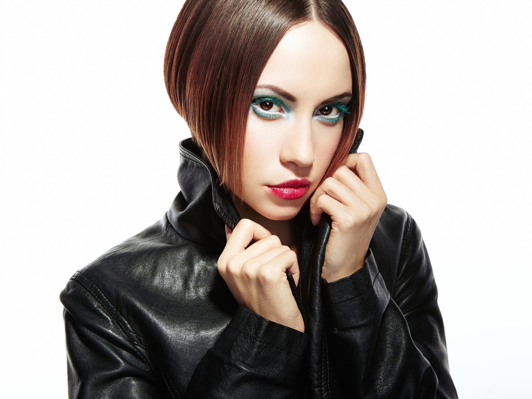 Portrait of a beautiful brunette woman in leather jacket.