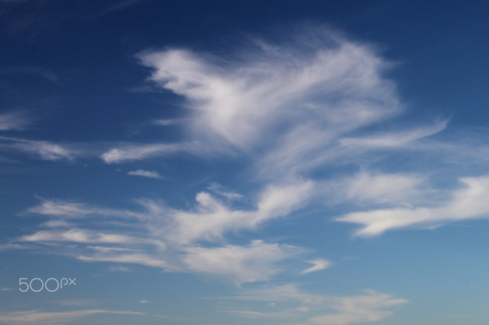 Canon EF-S 18-55mm F3.5-5.6 sample photo. Swirling clouds photography