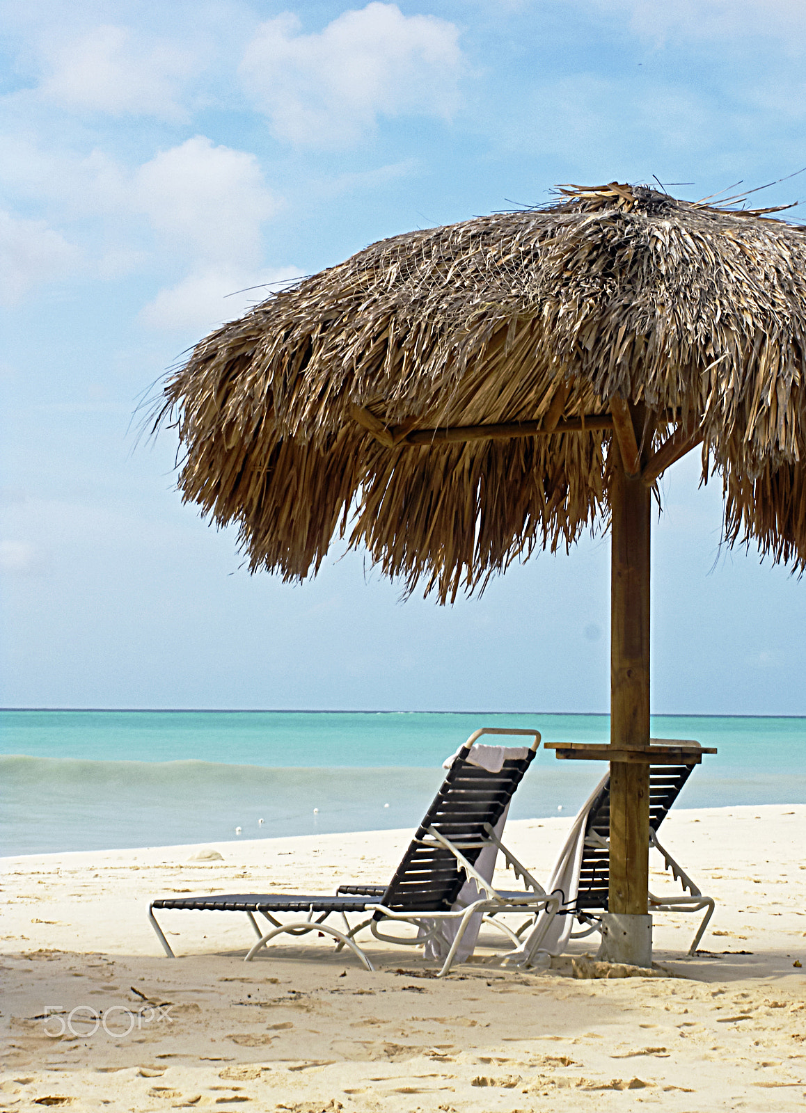 Pentax Optio M60 sample photo. Chairs on the beach photography