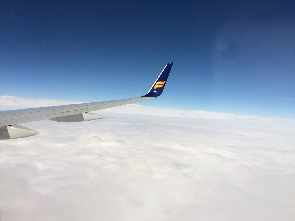 IcelandAir flying above clouds by Marc Salm on 500px.com