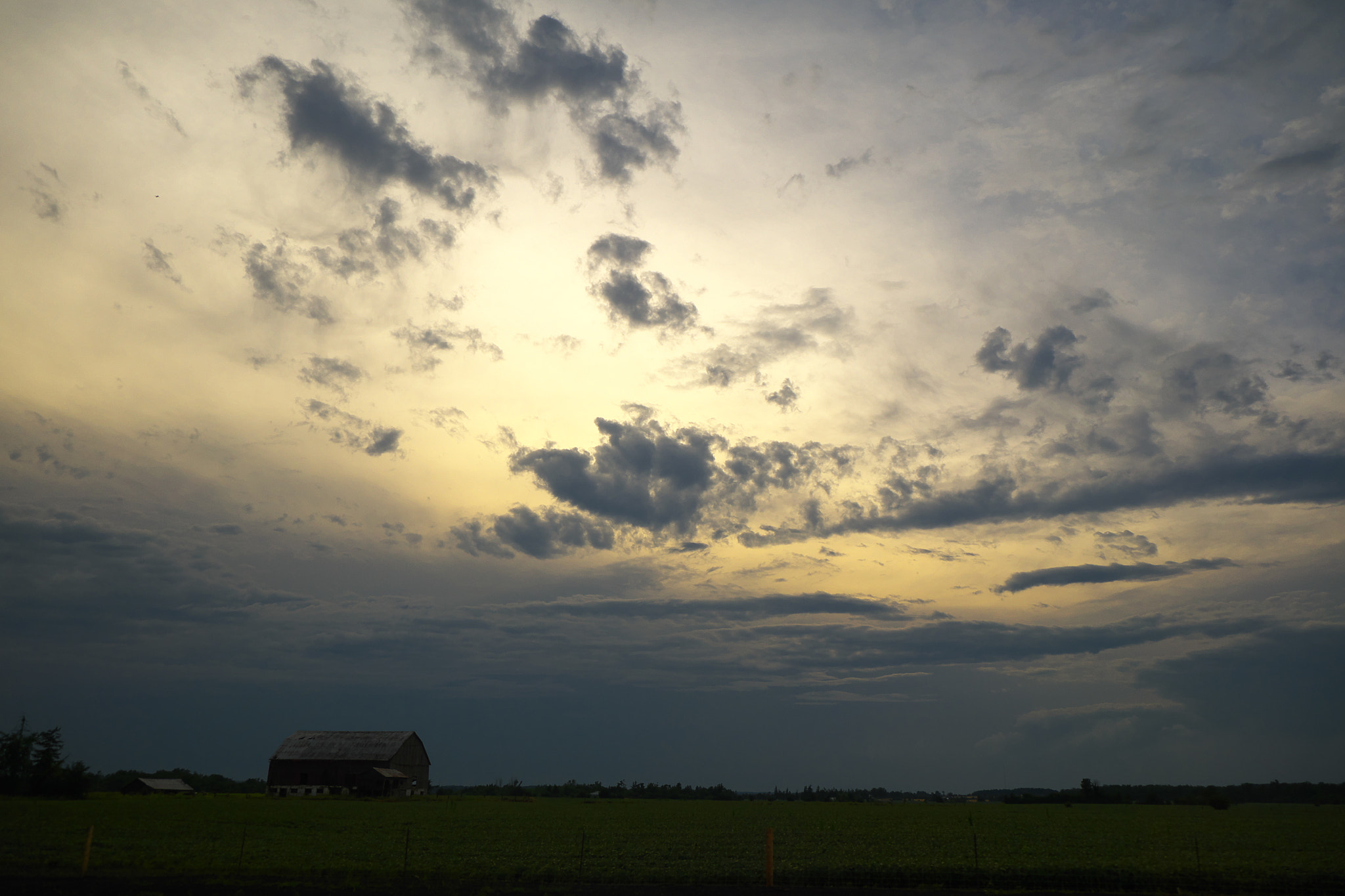 Fujifilm X-A1 + Fujifilm XF 18-55mm F2.8-4 R LM OIS sample photo. Barn with clouds 2015.08.02 photography